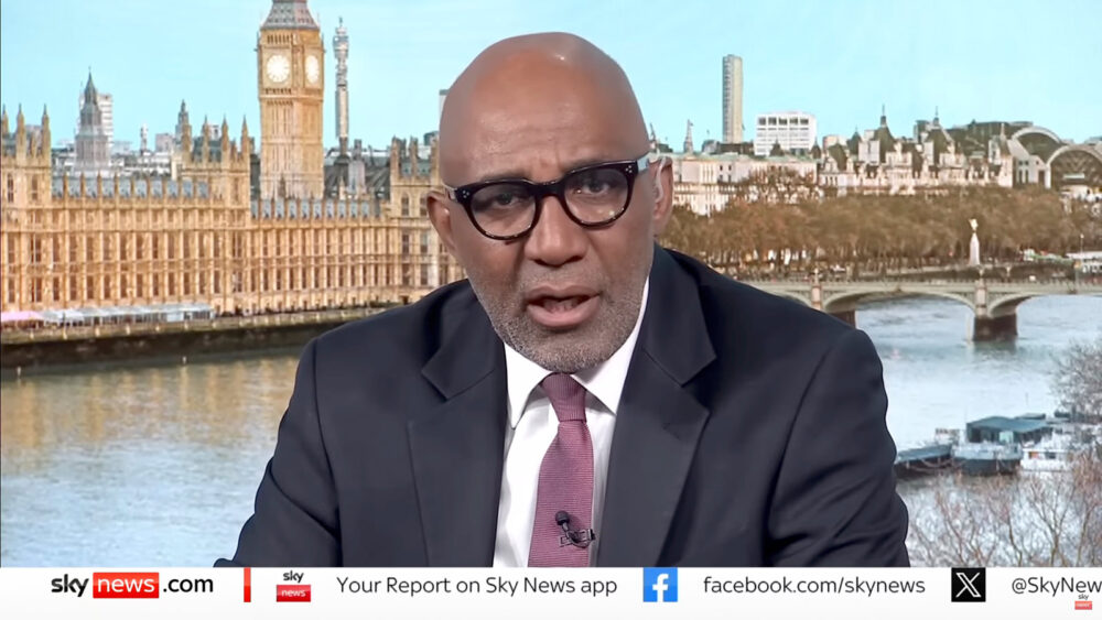 Image showing Trevor Phillips in the new Sky News studio with a view of London behind him